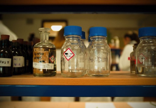 Chemical bottles with durable polyester GHS labels
