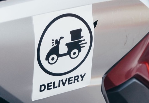 Vinyl delivery decal on a vehicle